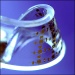 Electronic components historically have been flat and unbendable because silicon, the principal component of all electronics, is brittle and inflexible. Any significant bending or stretching renders an electronic device useless.