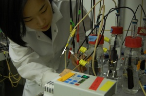 Dr. Hana Yi takes a reading from fuel cells.