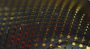 Stretchable micro-LED display, consisting of an interconnected mesh of printed micro LEDs bonded to a rubber substrate. Photo by D. Stevenson and C. Conway, Beckman Institute, University of Illinois
