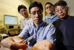 Georgia Tech researchers Meilin Liu, Mingfei Liu, Lei Yang and Kevin Blinn examine a sample of their new fuel cell material.