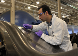 TAI employee Muharrem Balci uses techniques learned during the manufacturing training to repair tiny imperfections in the surface of the mandrel used to produce the F-35