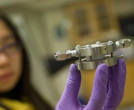 Doctoral student Yi-Chun Lu holds an experimental lithium-air battery that was used for testing at MIT. 
Photo: Patrick Gillooly 