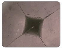 Microstructure of a Low Fracture Toughness advanced ceramic.