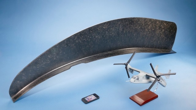 Example of a large compression molded part used on the V-22 Osprey helicopter. ( 60 in length x 8 inch base, and 12 inches height 152x20x31 cm).