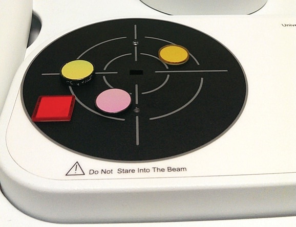 Sample measurement surface of the URA accessory. Using internal kinematic optics the light beam is directed to the measurement port at the center. Samples lay flat covering the port.