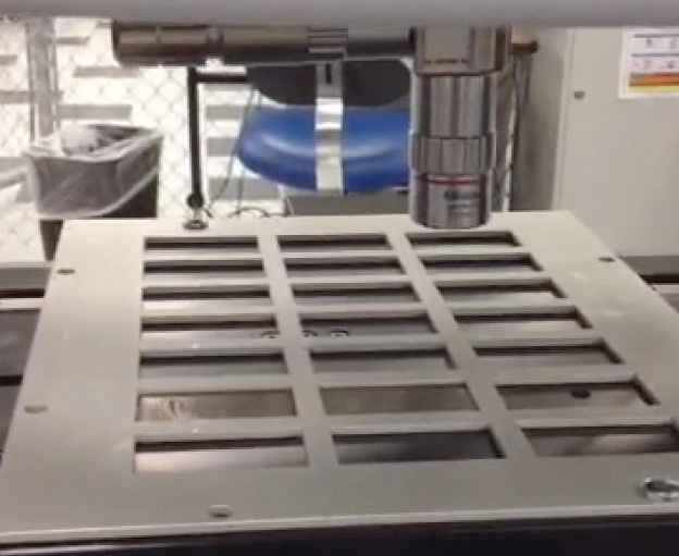 Automated coupon tray on NPFLEX stage