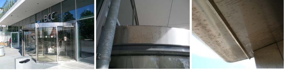 A revolving door with all kinds of rusty spots