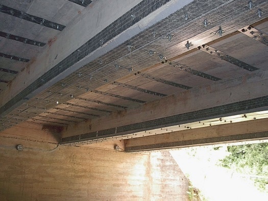 The posted load for this bridge that spans the Meramec River in Missouri was increased from 10 tons to 18 tons by installing SAFSTRIP® using the MF-FRP system.