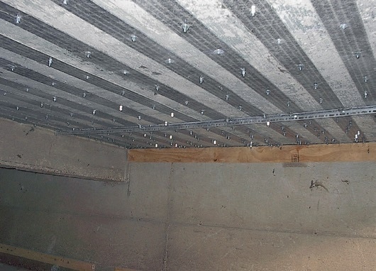 This bridge, located in St. James, Missouri, was load posted at the time of strengthening. After mechanically attaching SAFSTRIP® with concrete wedge bolts and anchors, the bridge load limit was raised to 20 tons.
