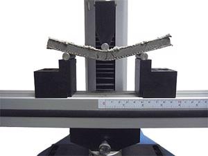 Sample undergoing flexure testing
