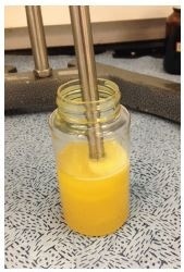 Homogenizing a sample of water contaminated oil