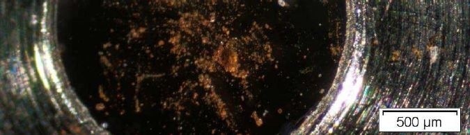 Optical Micrograph of Brown Residue on a sampling cell.