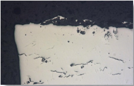 Image of the prepared specimen surface. Due to the polished surface the light is reflected almost equally and the microstructure is not discernible.