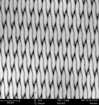 SEM images of two metal grids, using 15 kV (top) and 10 kV (bottom) beam