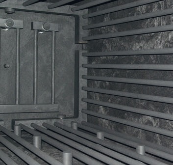 View into HTK 400 mantle heater with back wall heating and several graphite pillars at the bottom supporting the movable retort for convenient loading and unloading of the furnace.