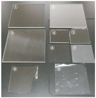 Plastics of Different Materials and Surface Treatments 1: PMMA (Clear), 2: PMMA (Matte), 3: PMMA (Textured), 4: PET, 5: PVC, 6: PVC (Clear), 7: PVC (Surface Treated), 8: PP, 9: PE