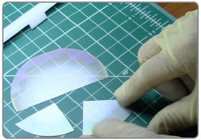 Sapphire wafer after cleaving perpendicular and parallel to the flat.