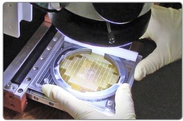 The FlipScribe is a scribing machine that makes the scribe on the backside of the sapphire
