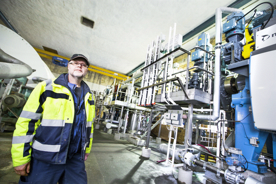 Ronny Svensson standing at the filter presses, where many ABB Measurement products are also installed
