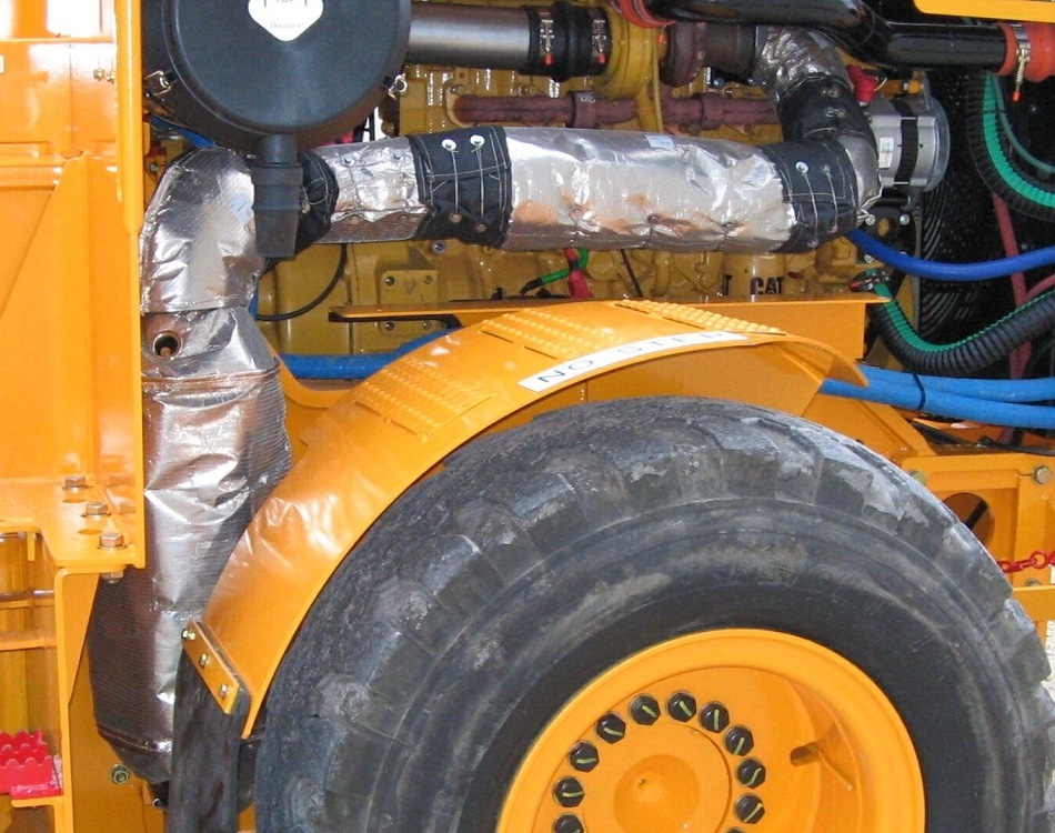 Firwin MineWrap™ Mark III removable blankets on mining truck catalyst and exhaust.