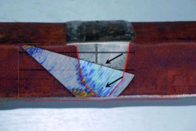 Shear wave UT scan. Scan at 5 MHz shown on top of an image of the component. The side-drilled holes (black arrows) were not detected.