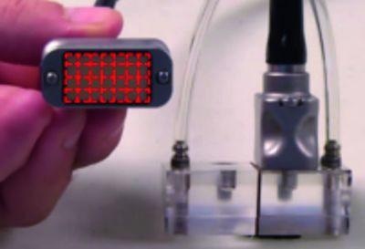 A wedge holding a DMA probe. The probe consists of two transducers containing 28 phased array elements each.