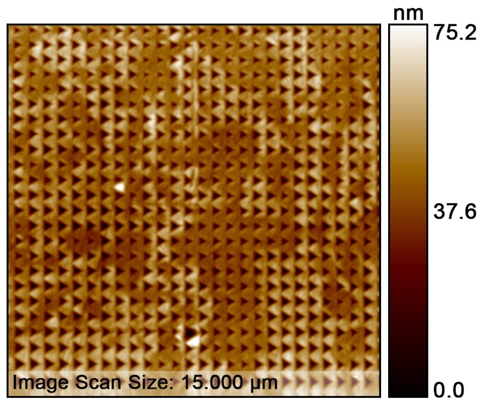 Topography image of the 100x100 indent pattern. The SPM image is showing a 15x15 µm scan of the 60x60 µm pattern area.