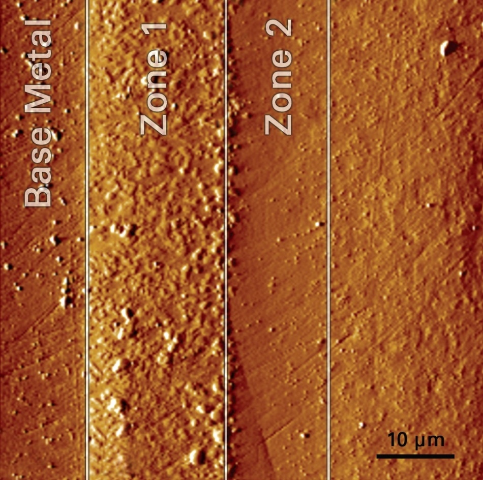 SPM image of the cross-sectioned sample surface showing the bond coat layers that were characterized. Images are collected with the same probe tip used to perform the tests, permitting very precise test positioning.