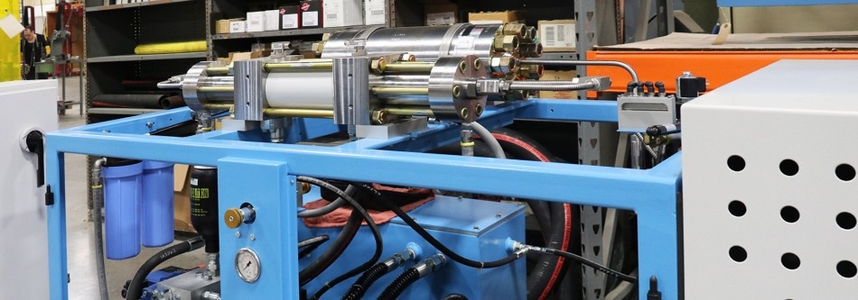 Robotic Cells with Hydraulic Intensifier Pumps