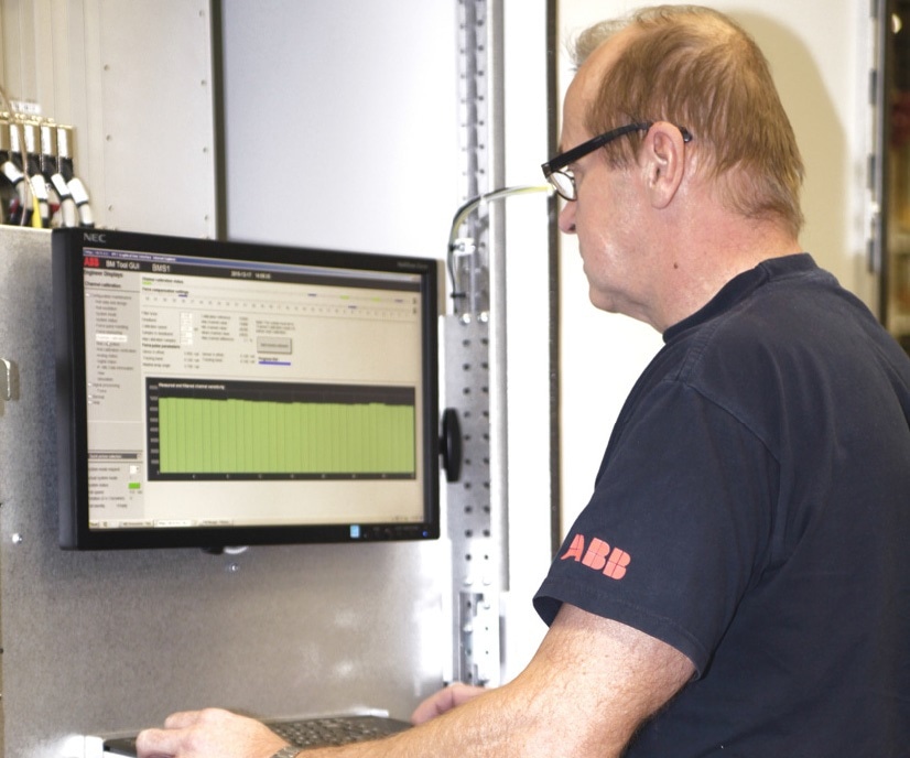 ABB Expert performing a comprehensive health check on a Stressometer system to enhance metal rolling mill performance and yield.