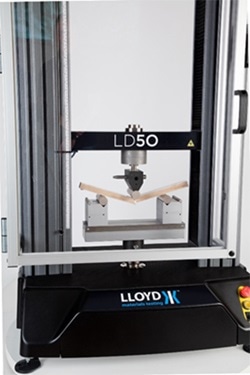 Materials tester with splinter shield