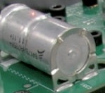 Laser “Dot” indicating signal capture spot on the body of the Capacitor mounted on a PCB.