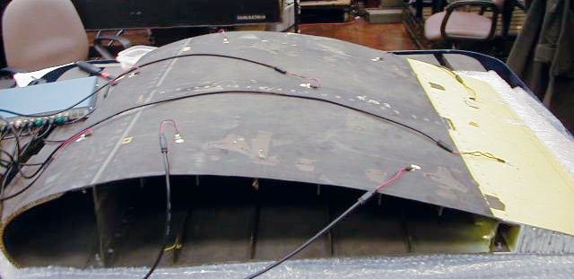Measurement Setup: Piezoactors for local excitation of Lamb waves on a carbon fiber wing section.
