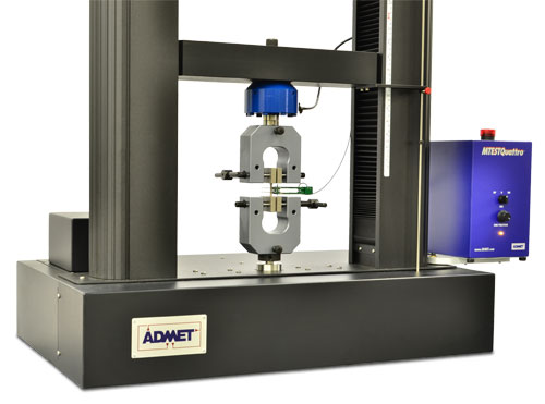 eXpert 2600 with manual vise grips and an axial extensometer.