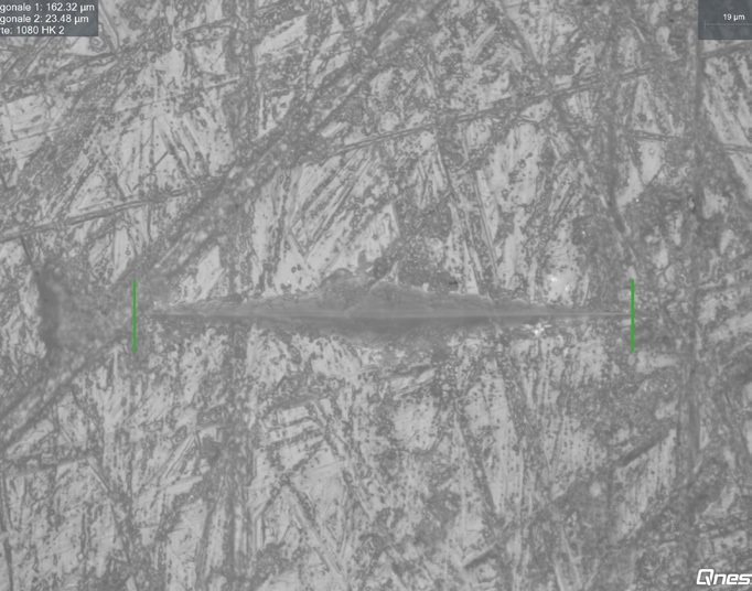 Knoop indent Surface hardness indent 40x microscope lens.