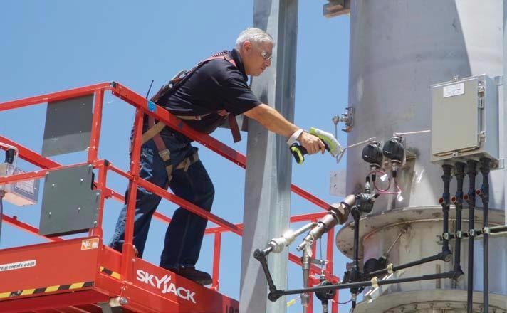 A technician performs positive material identification on pressure vessel components using the Thermo Scientific Niton XL5 analyzer.