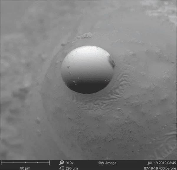 A silicon microsphere enlarged 910x.