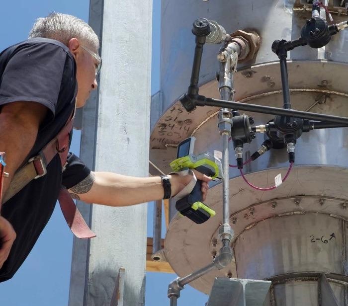 An inspection is conducted using the handheld Niton XL5 Plus XRF analyzer.