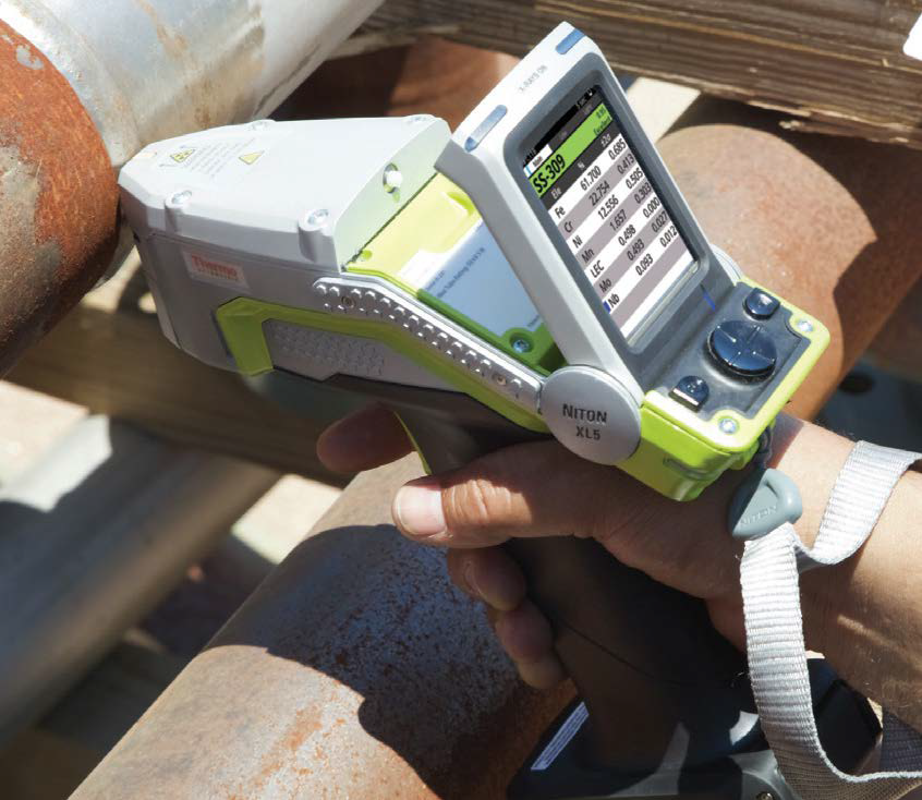 The Niton XL5 Plus in use, analyzing steel piping.