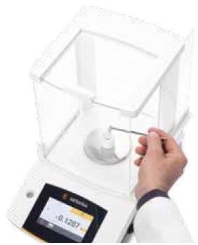 Applying accelerator to a weighed sample