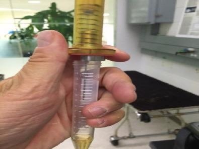 Sampling with the CUSTODION. The SPME fibre is housed in a durable syringe that is operated like a ball point pen.