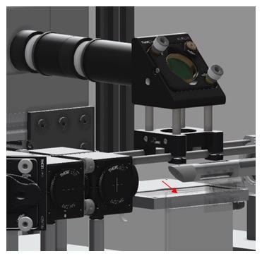 CAD image of the instrument – sample interface. Red arrow indicated sample position