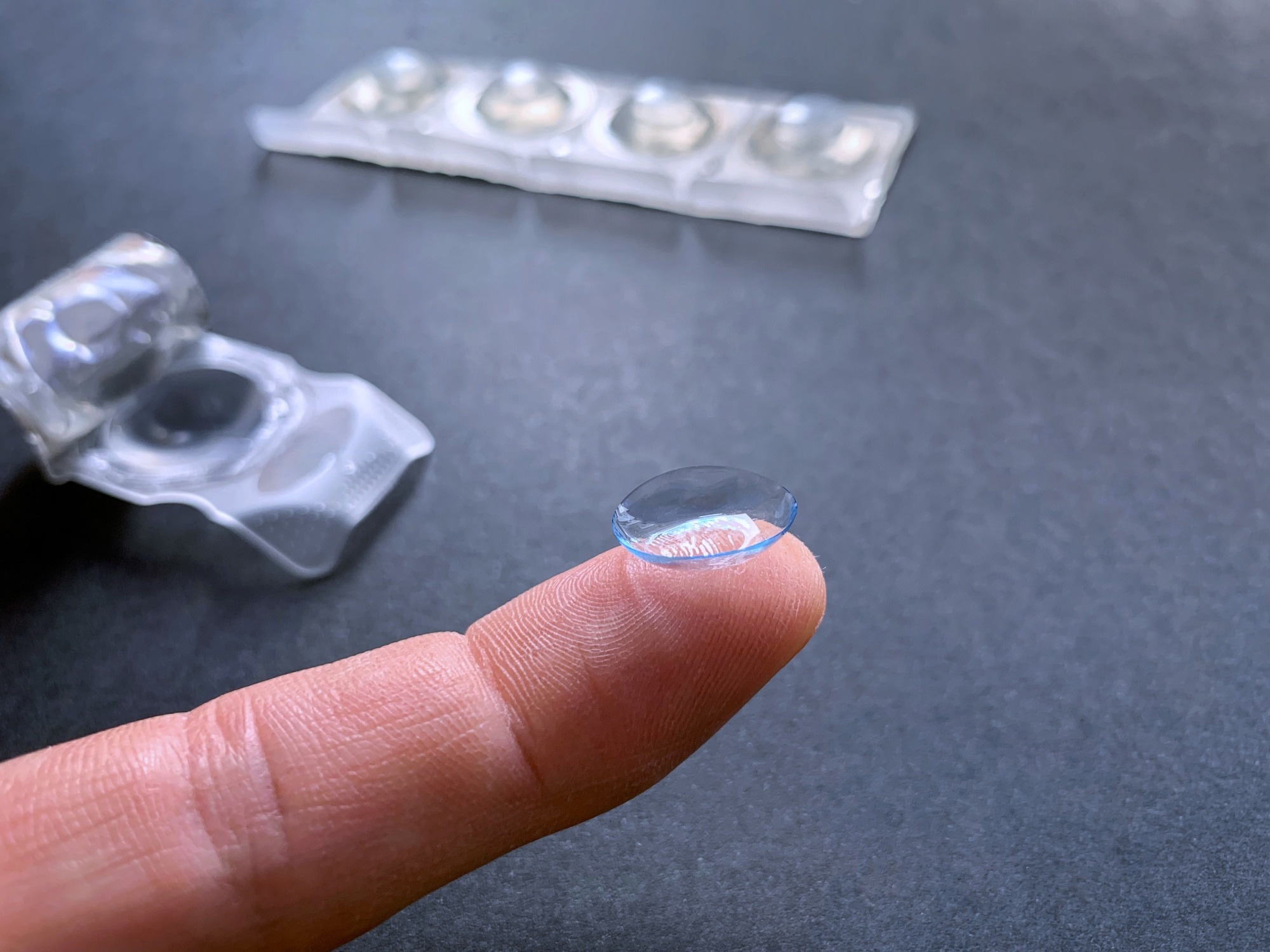 contact lens at the tip of the finger.