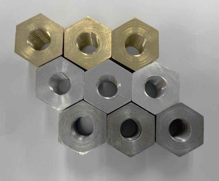 Tapped nuts after tapping torque test.