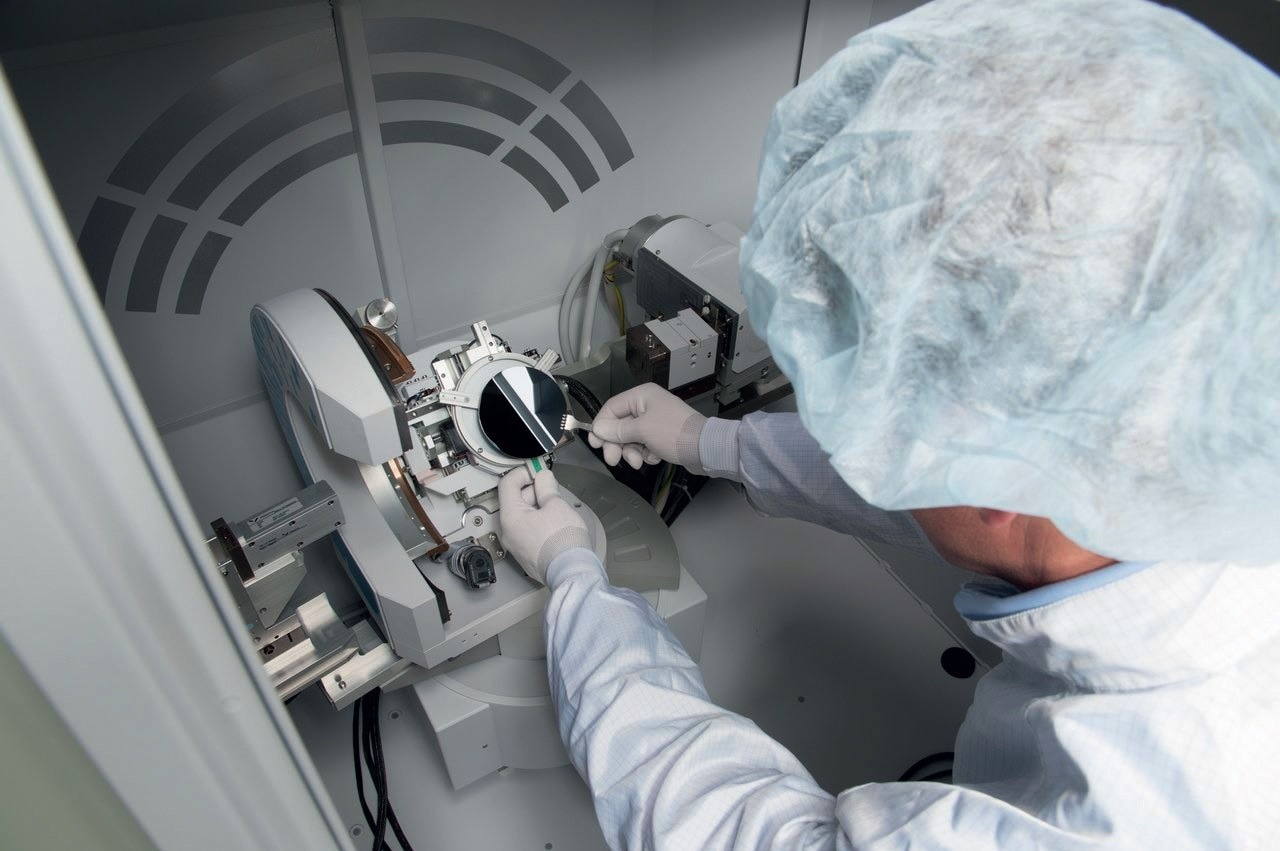 It is labor intensive to manually place wafers into metrology equipment and less reproducible than a robot with prealigner.