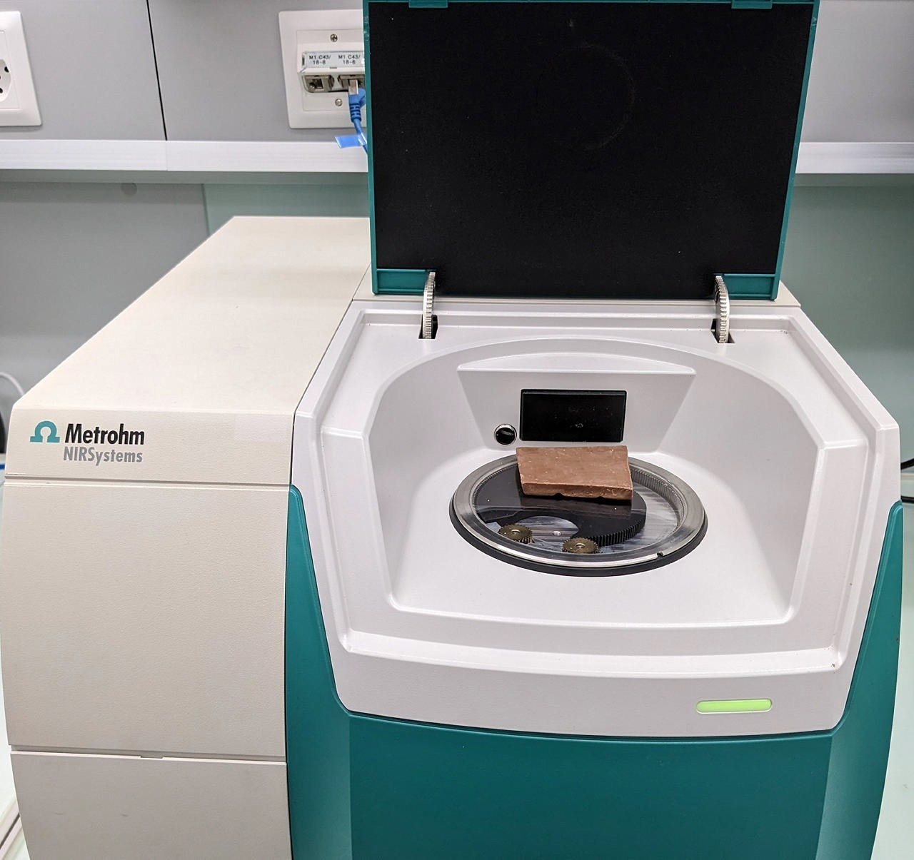 Metrohm NIRS DS2500 Solid Analyzer with a chocolate bar covering the sample window.