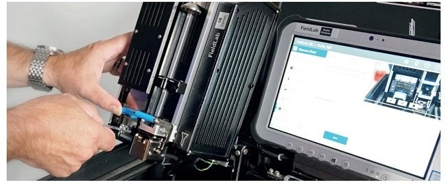 Inserting FPQ Filtergram specimen in position for the elements module for analysis by XRF on the active filter area.