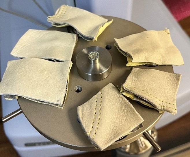 Samples (from Glove C in the photo) are loaded into the lower support