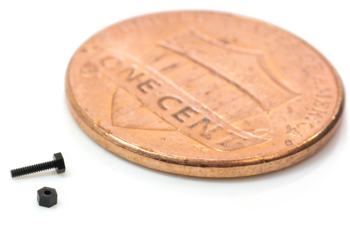 A 3D printed micro nut and bolt with M0.3 threads.