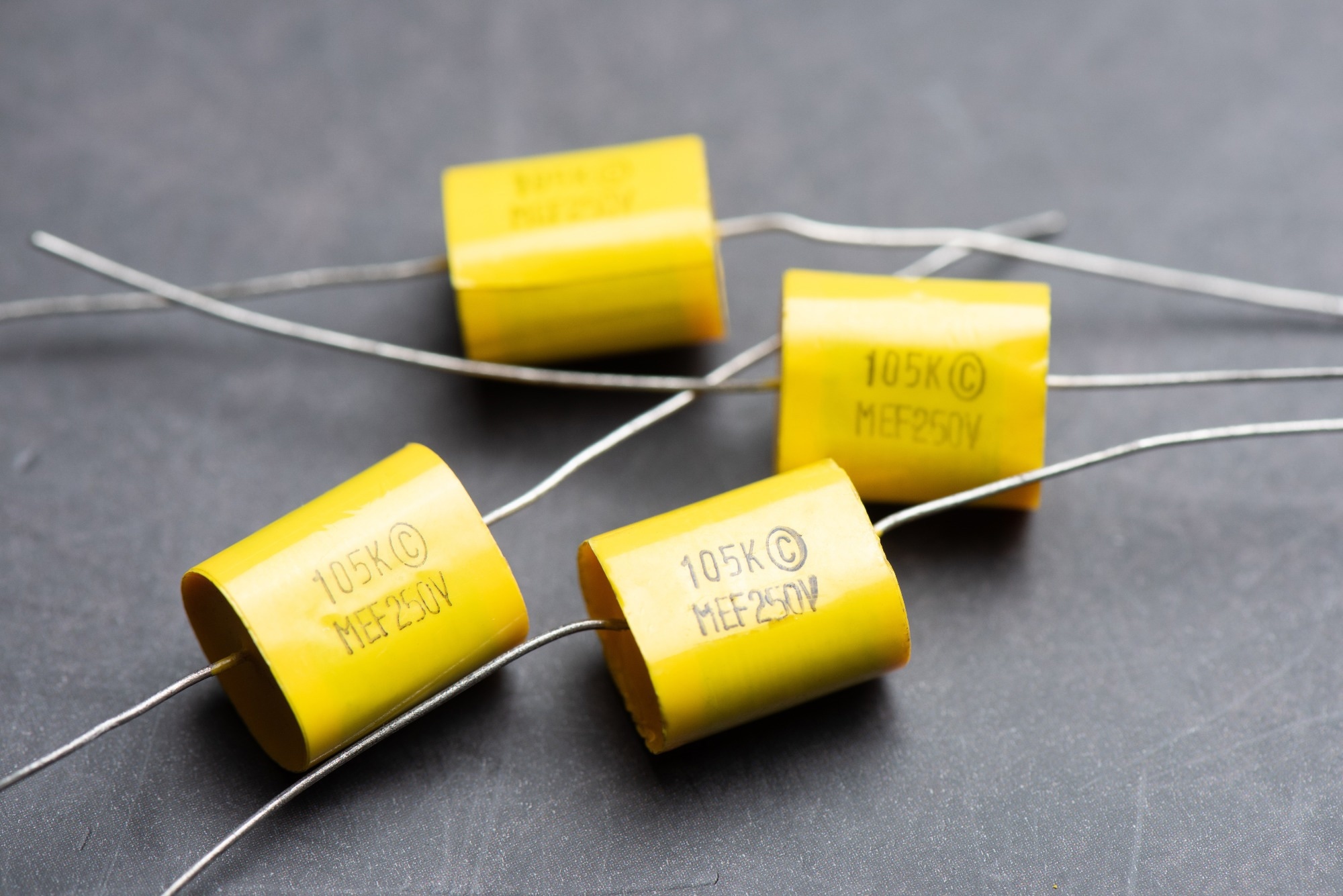 Metallized polyester film capacitors, used in electronic device.